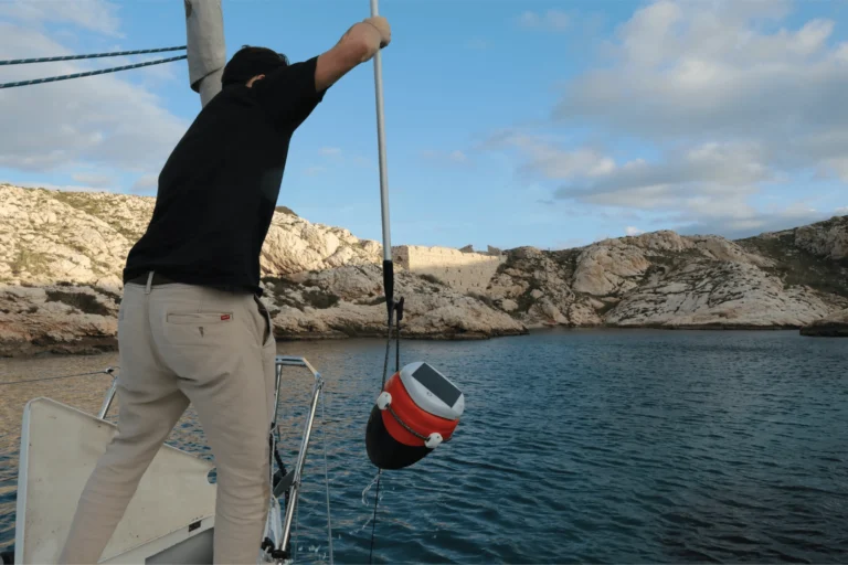 A sailor setting his GPS buoy - Anchor Alarm Bouy: Morpheis