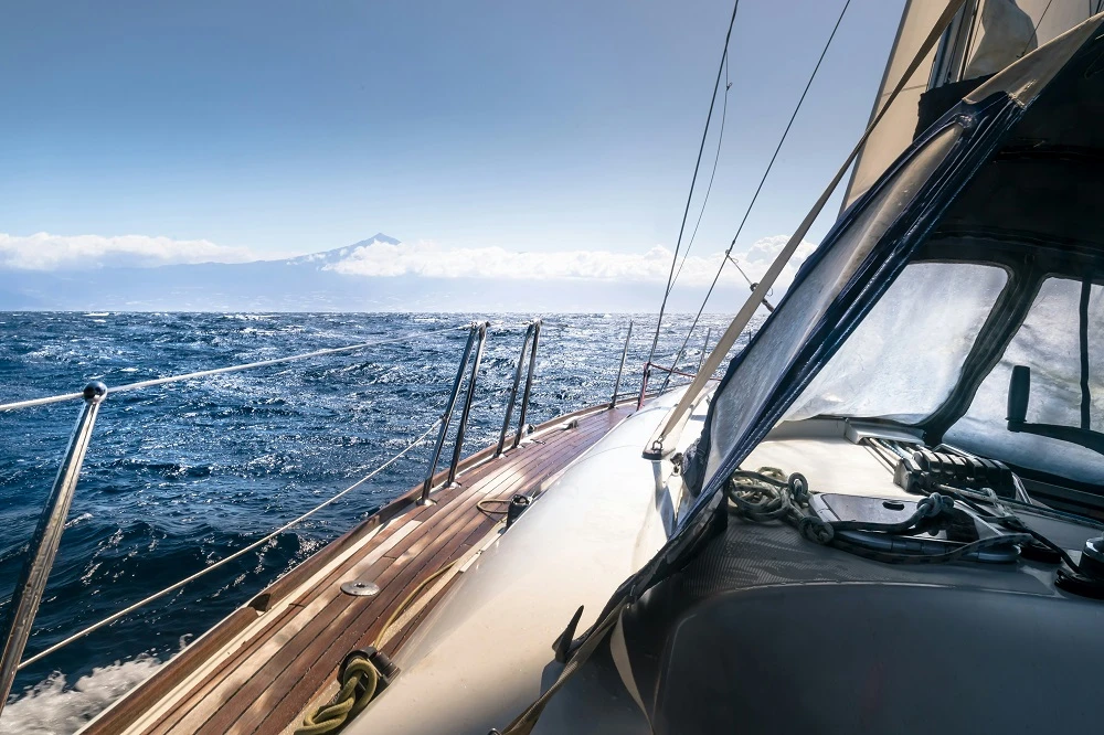 A sailing boat when wind changes direction at anchor
